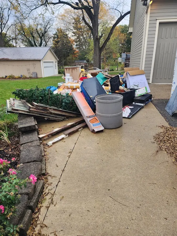 Dumpster being loaded with debris for 3 Yard Dumpster Rental in East Buffalo